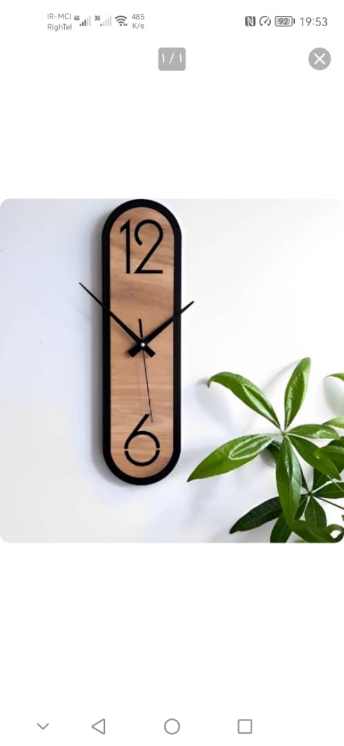 ساعت دیواری طرح کلاسیک چوبی دور مشکی دارای موتور آرامگرد 4127